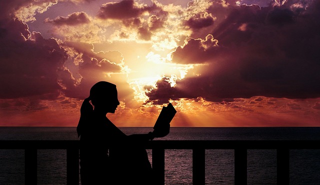 woman reading at sunset